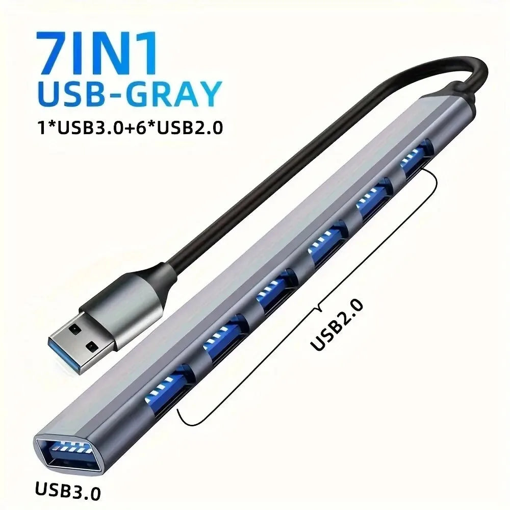 Aluminum 7-in-1 USB C Hub with USB 3.0, 4 USB 2.0, and 2 USB C ports for versatile device connectivity.
