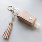 Leather portable keychain holder for universal leakproof hand sanitizer bottle, compact travel sanitizer container.
