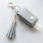 Leather portable keychain sanitizer holder with leakproof travel bottle, compact and empty for hand sanitizer on the go.