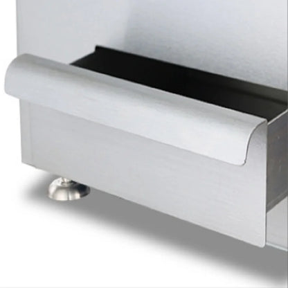 Stainless steel countertop gas griddle in a fast food restaurant kitchen, ideal for frying chicken cutlets and hamburgers.