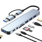 8-in-1 USB 3.0 Type-C dock with SD/TF card reader, dual-head hub, and 3.5mm audio jack for laptops.