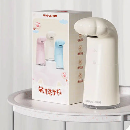 Automatic soap dispenser with cat paw design, sensing foam hand sanitizer, and children's bubble machine in household use.