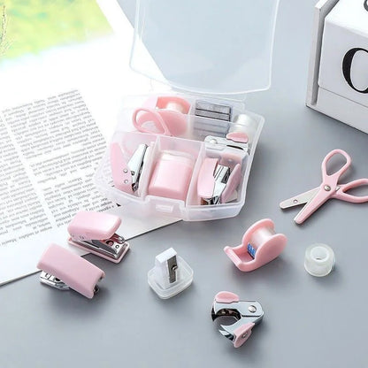 Pink 8-piece mini office supply kit with stapler, scissors, staple remover, tape dispenser, staples, and a scrapbook tool box.