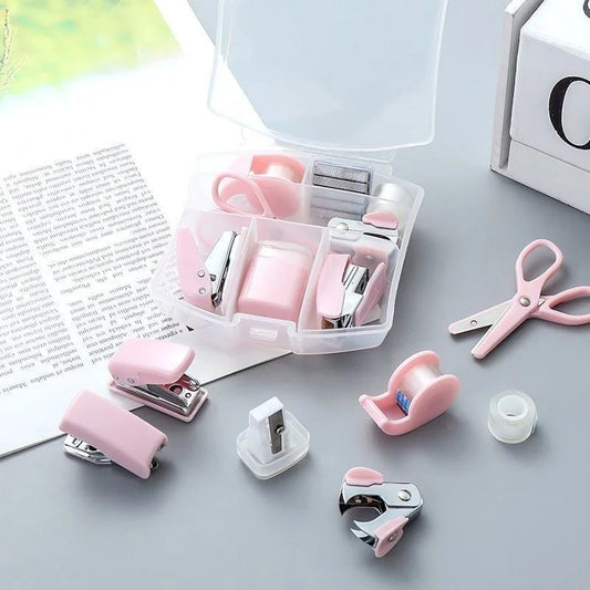 Pink 8-piece mini office supply kit with stapler, scissors, staple remover, tape dispenser, staples, and a scrapbook tool box.