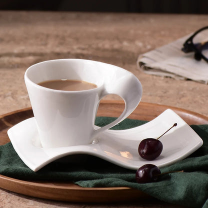 White ceramic wavy espresso cup from BackupMyFilesNow.com, ideal for coffee, breakfast, or dessert, with a modern, stylish design.