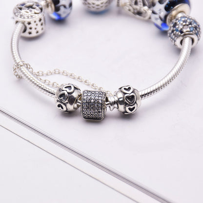 Blue glass crystal bracelet with silver 925 setting, women's jewelry featuring elegant, sparkling design.