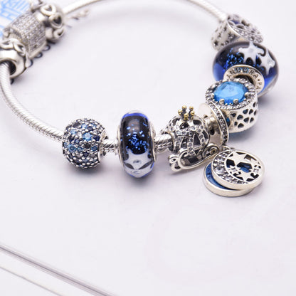 Blue glass crystal bracelet with silver 925 setting, women's jewelry featuring elegant sparkling gemstones.