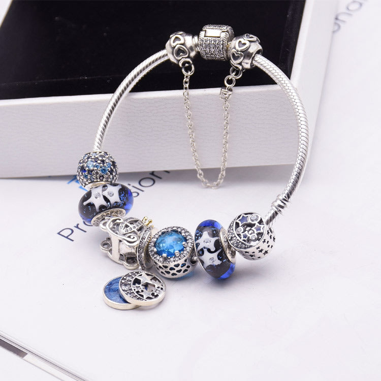 Blue glass crystal bracelet with silver 925 accents, elegant women's jewelry featuring sparkling blue gemstones and silver details.
