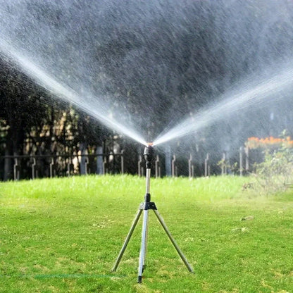 Stainless steel 360 rotary lawn sprinkler on telescopic tripod support for garden irrigation, adjustable height.