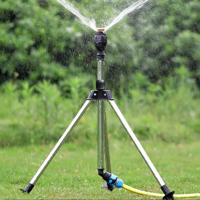 Stainless steel 360 rotary lawn sprinkler on telescopic tripod with adjustable support for garden irrigation.