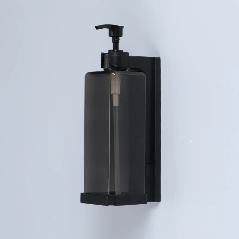 Wall-mounted hotel shampoo and shower gel bottles with hand sanitizer boxes and manual soap dispensers for bathroom use.