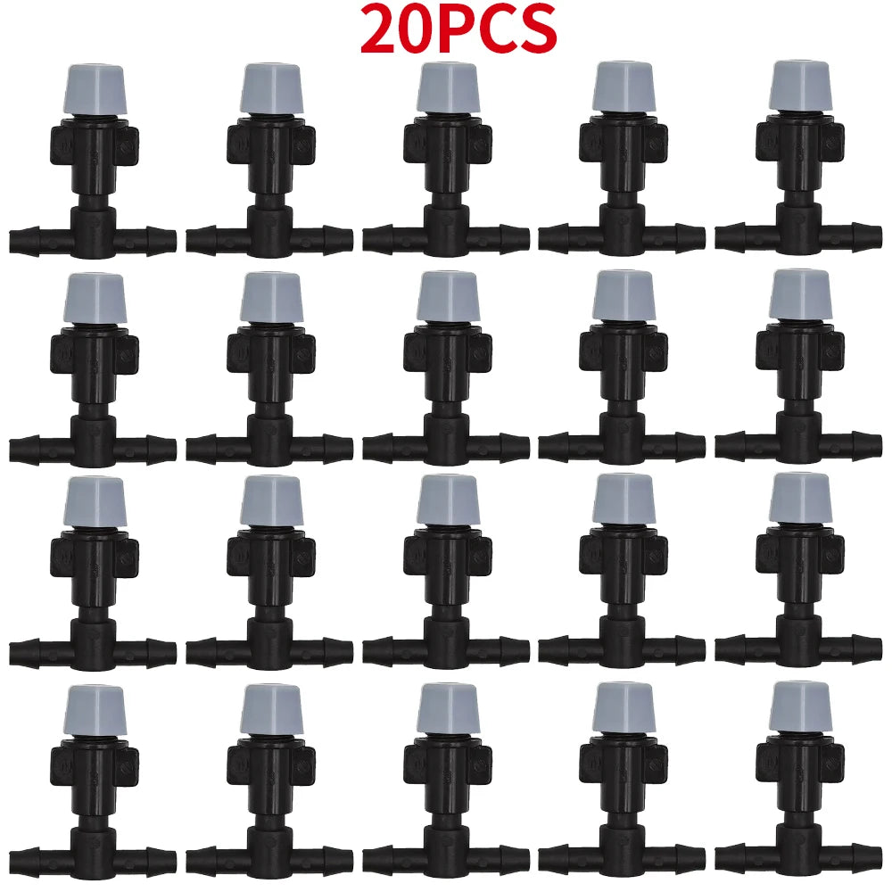 WUJIE 20-pack plastic garden irrigation sprinkler heads with nozzles and tee joints for misting and watering plants.