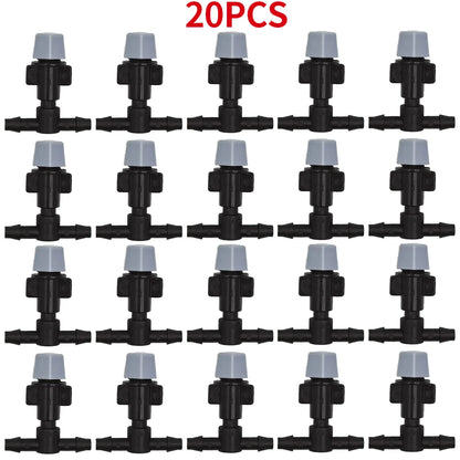 WUJIE 20-pack plastic garden irrigation sprinkler heads with nozzles and tee joints for misting and watering plants.
