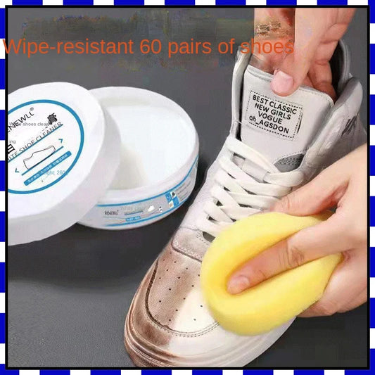 Anhydrous cleaning cream by BackupMyFilesNow.com being applied to small white canvas sneakers for household shoe cleaning.