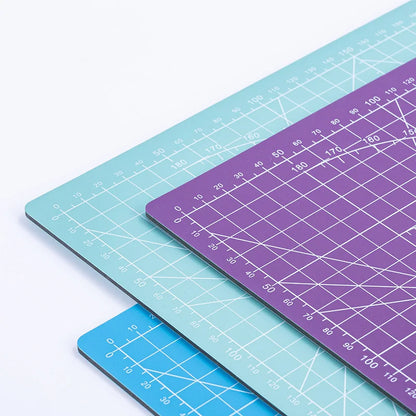 PVC cutting pad in various sizes, ideal for art drawing, patchwork sewing, and craft projects, providing a protective surface.