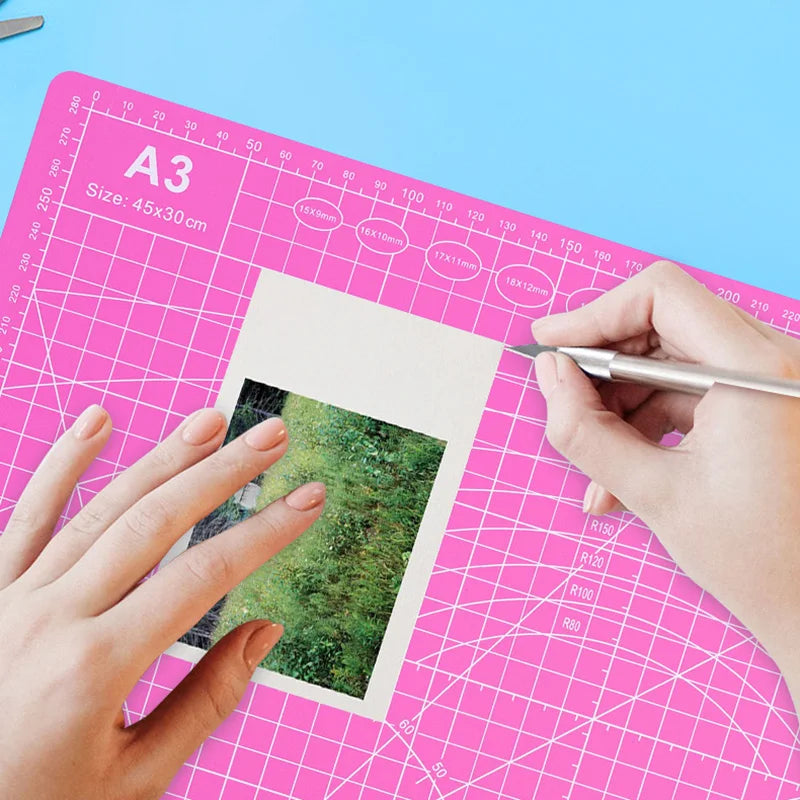 PVC cutting pad in various sizes, ideal for art drawing, patchwork sewing, and craft projects, providing protective surface.