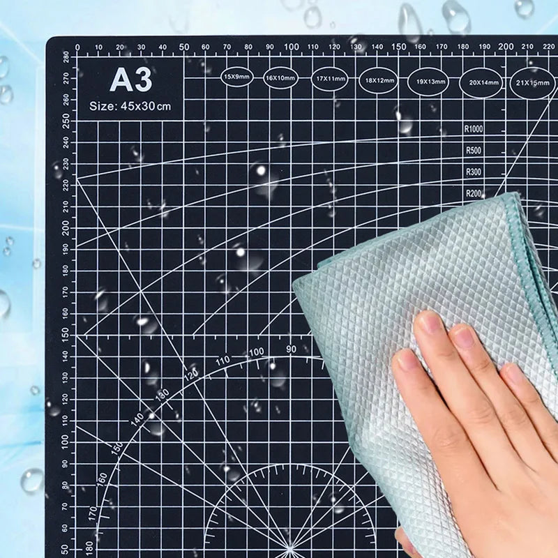PVC cutting pad in various sizes, used as a protective table mat for art drawing, patchwork sewing, and craft making.