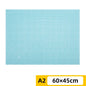 PVC cutting pad in various sizes, used as a protective table mat for art drawing, patchwork sewing, and craft making.