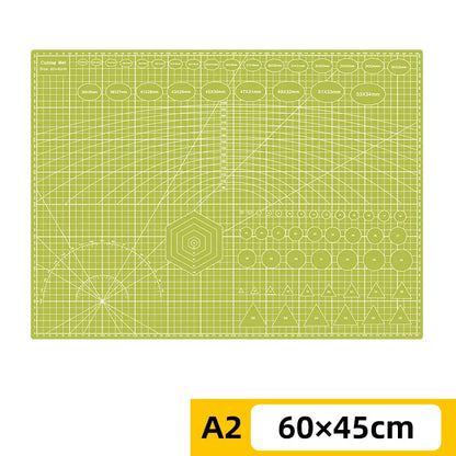 PVC cutting pad in various sizes, used as a protective table mat for art drawing, patchwork sewing, and craft projects.