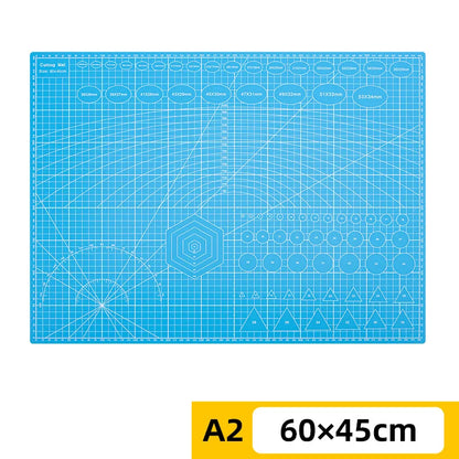 PVC cutting pad in various sizes, ideal for art drawing, patchwork sewing, and craft projects, offering protective surface for table use.