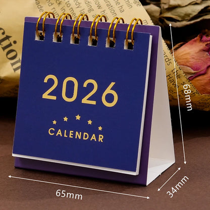 Mini 2026 calendar from BackupMyFilesNow.com, featuring a desk planner and office stationery for organizing and decorating workspace.