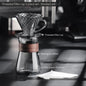 Amber gold borosilicate glass coffee dripper set with sharing pot and V02 coffee filter for hand-brewed coffee.