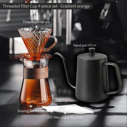 Amber gold borosilicate glass coffee dripper set with sharing pot, filters, and server for hand-brewed coffee.