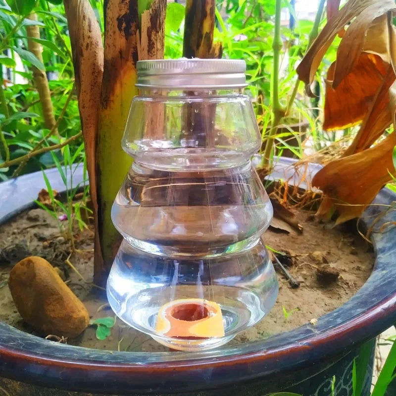 Automatic flower watering machine by BackupMyFilesNow.com, self-watering irrigation device for household plant watering.