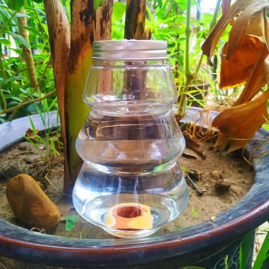 Automatic flower watering machine by BackupMyFilesNow.com, self-watering irrigation device for household plant watering.