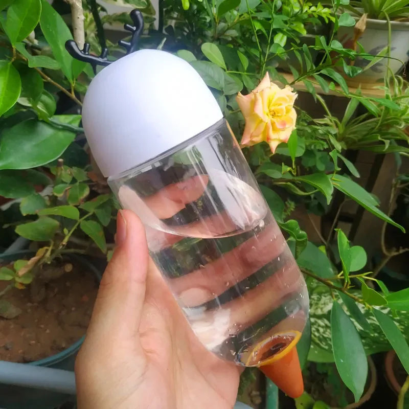 Automatic flower watering machine by BackupMyFilesNow.com, designed for household self-watering and plant irrigation.