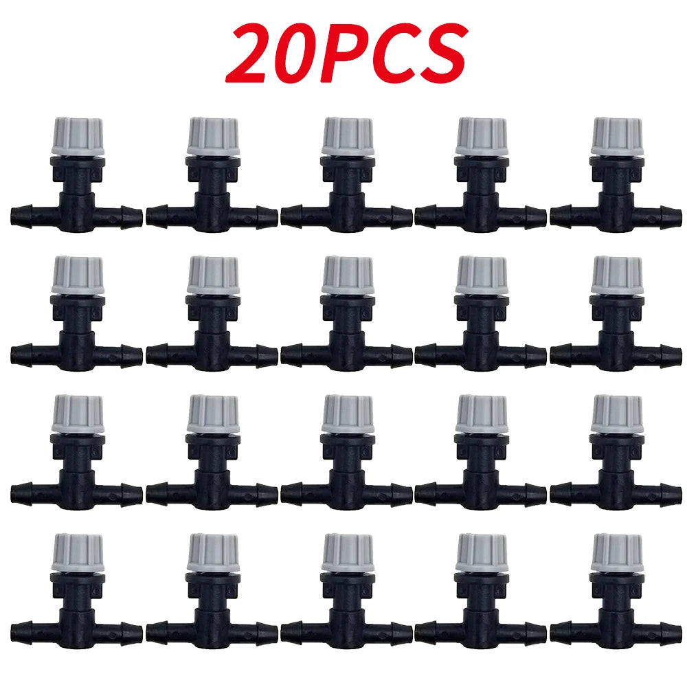 OAISI 20-pack plastic garden watering misting sprinkler heads with nozzles and tee joints for irrigation systems.