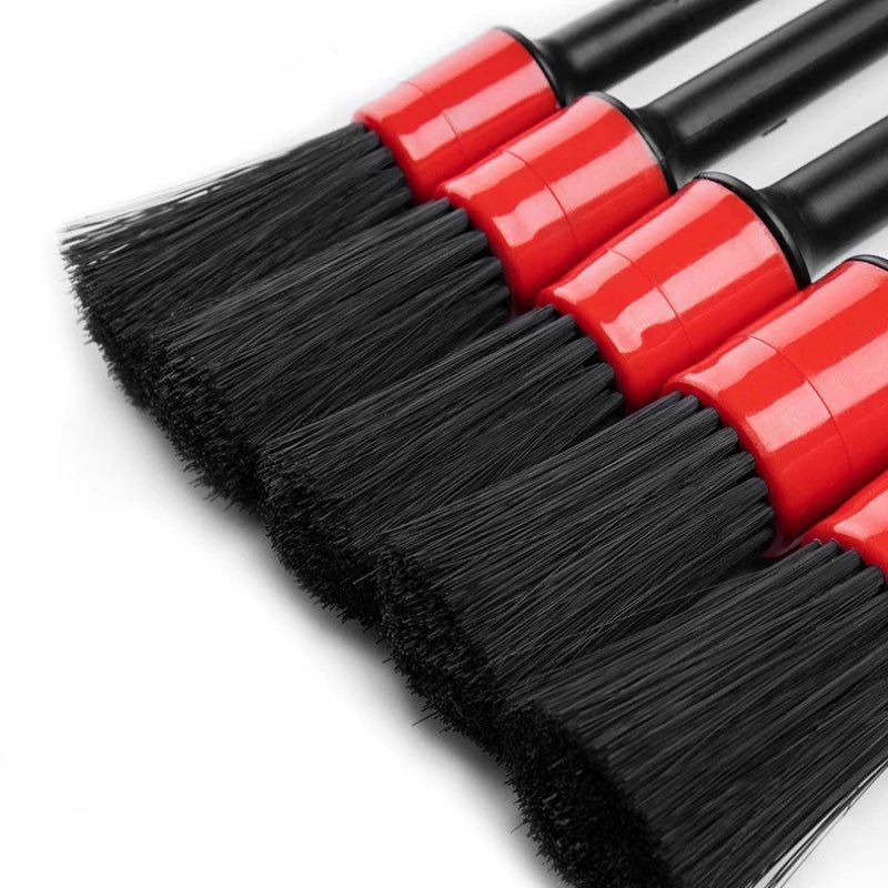 Automotive car cleaning brush kit with interior, wheel, rim, and plastic detailing brushes for thorough vehicle cleaning.
