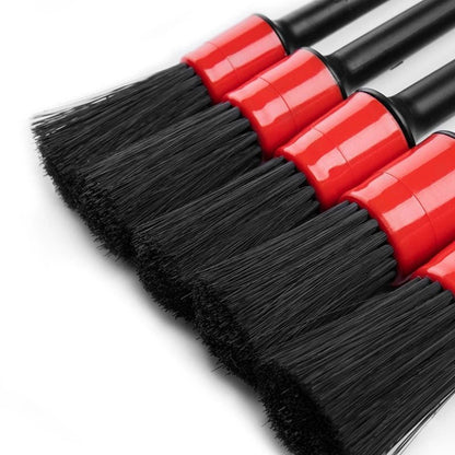 Automotive car cleaning brush kit with interior, wheel, rim, and plastic detailing brushes for thorough vehicle cleaning.