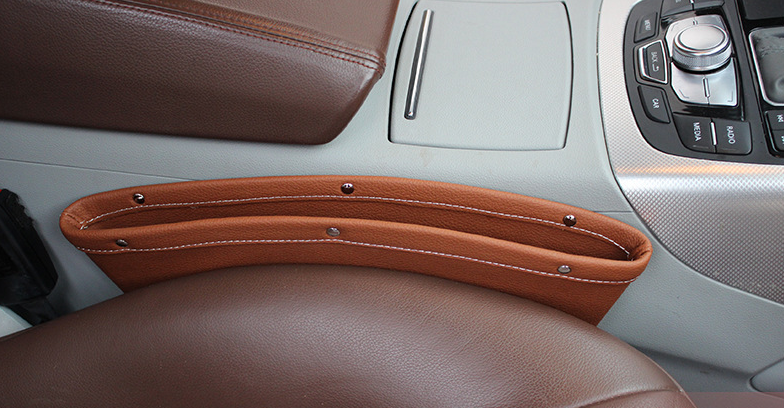 Beige car seat gap storage organizer with trash box for vehicle, designed to keep essentials tidy and within reach.