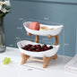 Beige multi-layer fruit rack by BACKUPMYFILESNOW.COM® with two tiers for organized fruit storage.