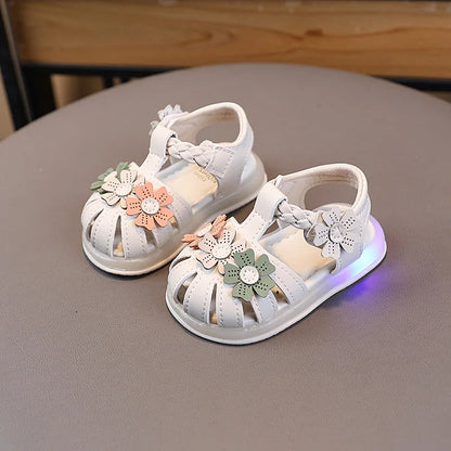 Beige summer kid sandals with LED lights, princess flower design, lightweight and versatile retro style for girls.
