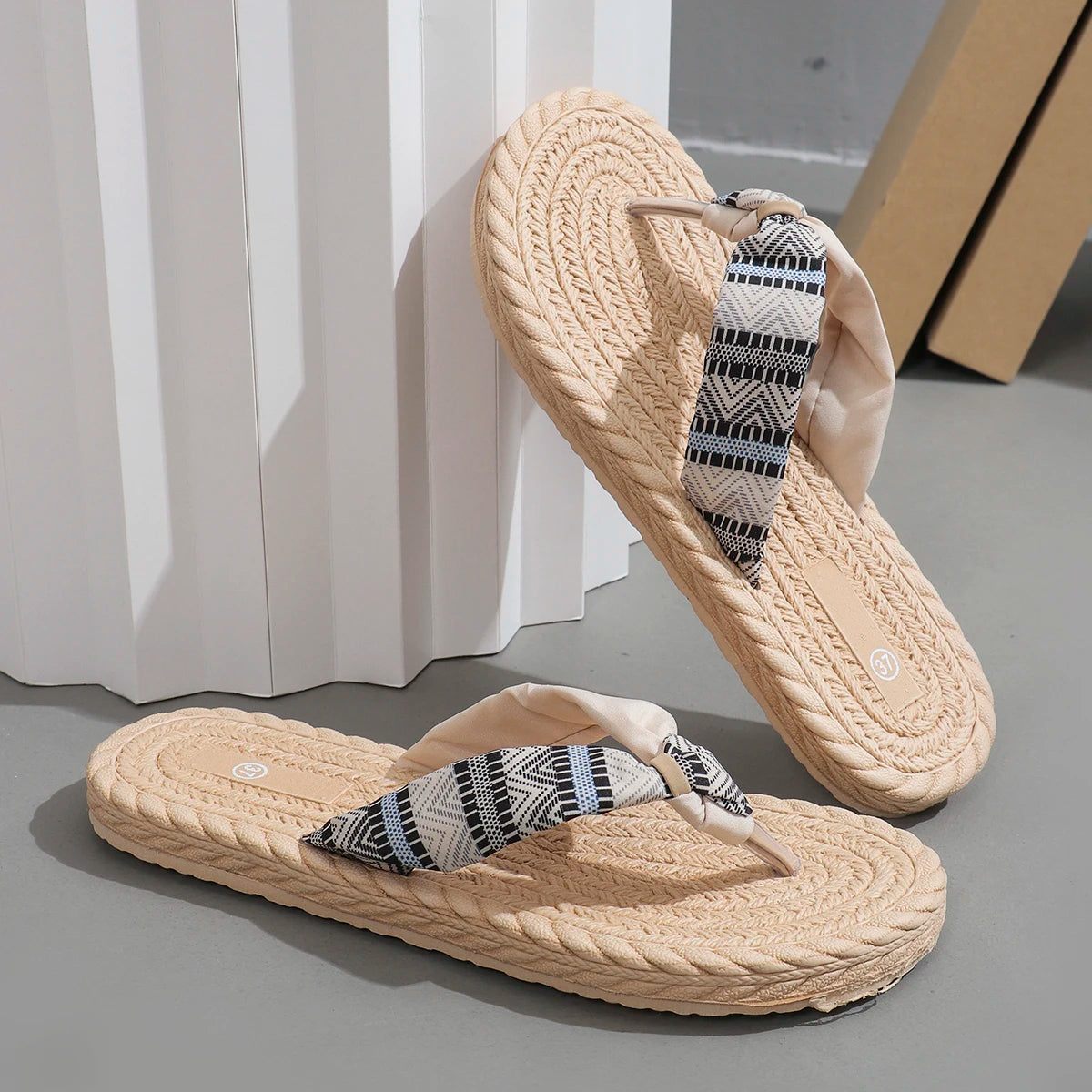 Beige women's fashion flip-flops with ethnic graffiti design, soft sole, anti-slip, wear-resistant, and anti-linen features.