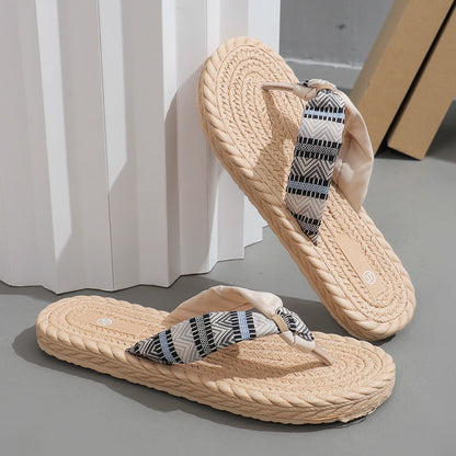 Beige women's fashion flip-flops with ethnic graffiti design, soft sole, anti-slip, wear-resistant, and anti-linen features.