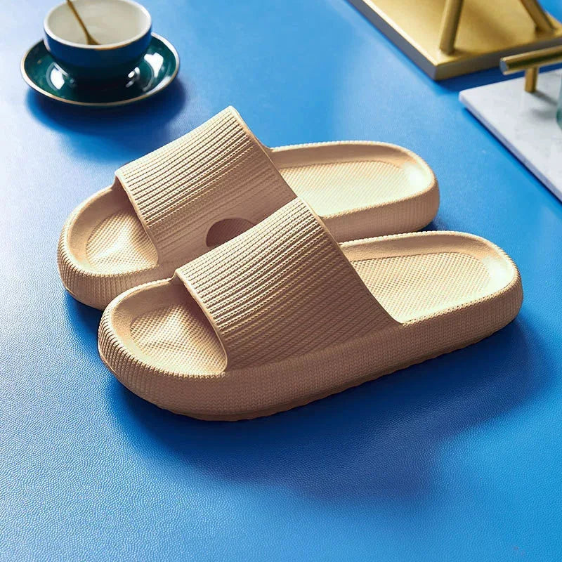 Beige EVA thick sole beach slippers with 4cm height increase, cloud-like comfort, solid color summer indoor sandals for couples.