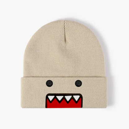 Beige embroidered knitted hat with cartoon design, suitable for men and women, warm, windproof, and trendy for autumn and winter outdoor wear.