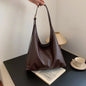 Beige HOMEFISH tote bag with shoulder strap, retro simple design, large size, suitable for women, featuring a hand bill of lading style.