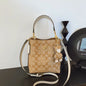 Elegant beige bucket handbag by BackupMyFilesNow.com, featuring a stylish, luxurious design perfect for versatile occasions.