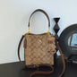 Elegant beige bucket handbag by BackupMyFilesNow.com, showcasing stylish design and versatile use for various occasions.