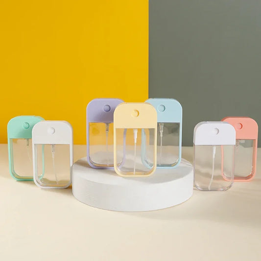 Portable 45ml square perfume spray bottle from BackupMyFilesNow.com, refillable silicone atomizer for perfume or sanitizer.