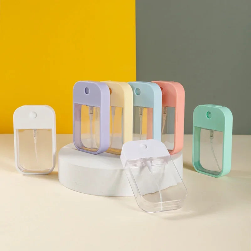 Portable 45ml square perfume spray bottle by BackupMyFilesNow.com, refillable silicone travel atomizer for perfume or sanitizer.