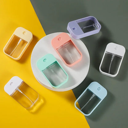 Portable 45ml square perfume spray bottle by BackupMyFilesNow.com, refillable silicone atomizer for travel and hand sanitizer.