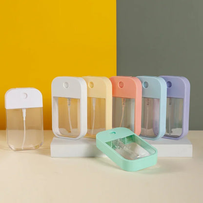 Portable 45ml square perfume spray bottle with refillable silicone design, ideal for travel and carrying perfume or sanitizer.