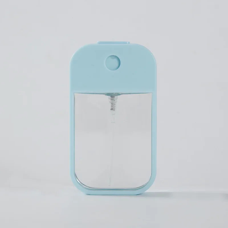 Portable 45ml square perfume spray bottle with refillable silicone body, suitable for travel, perfume, sanitizer, and makeup.