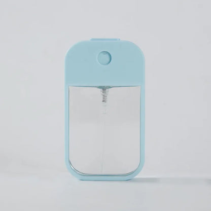 Portable 45ml square perfume spray bottle with refillable silicone body, suitable for travel, perfume, sanitizer, and makeup.