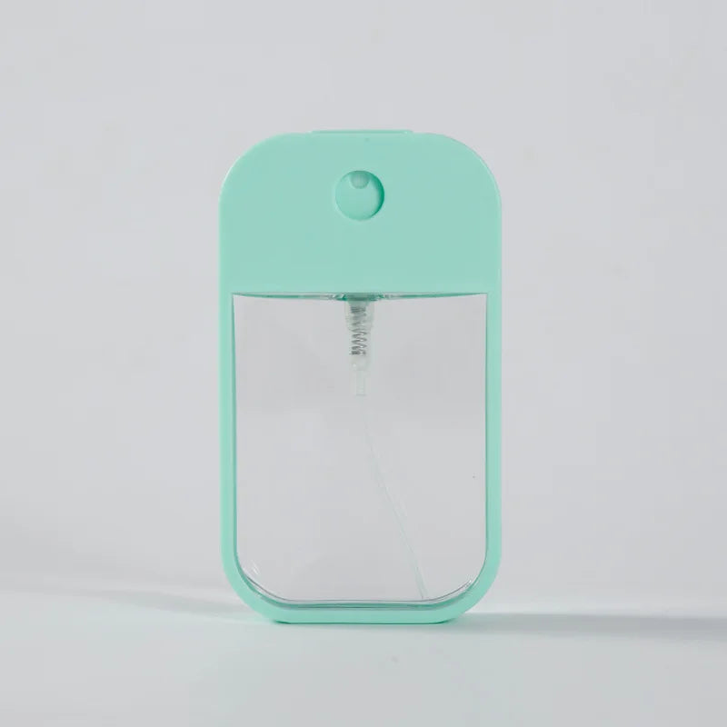 Portable 45ml square perfume spray bottle by BackupMyFilesNow.com, refillable silicone travel atomizer for perfume or sanitizer.